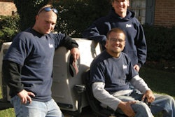 Stephen Price with mowing crew members Shawn Vandiver (sitting) and Brian Reed (left)