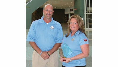 Cindy Payne (Kevin’s wife) and general manager John Stuhlsatz accepted their Pros in Excellence Award at GIE+EXPO 2008 in Louisville.
