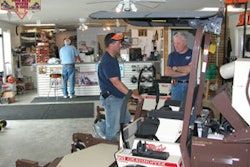 David Cox (left) talks with a prospective prosumer customer. The dealership’s suppliers say David’s personable nature and knack for making brand new customers feel like lifelong friends are among his strongest traits.