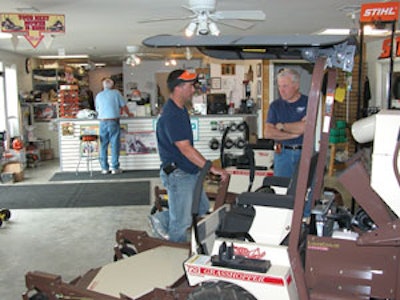 David Cox (left) talks with a prospective prosumer customer. The dealership’s suppliers say David’s personable nature and knack for making brand new customers feel like lifelong friends are among his strongest traits.