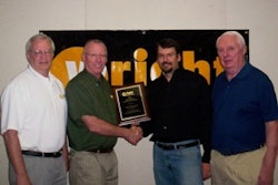 Wright VP of Sales & Marketing Hal White (second from left) presents his companys 2010 Distributor of the Year plaque to EDM VP Joe McLean as EDM Field Sales Manager Bill Stantial (left) and VP of Sales Mike Flynn look on.