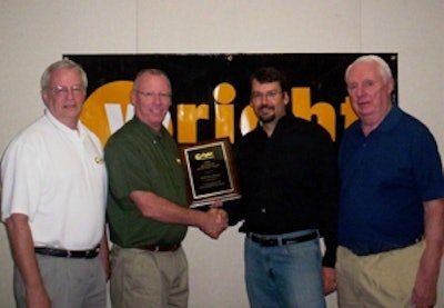 Wright VP of Sales & Marketing Hal White (second from left) presents his companys 2010 Distributor of the Year plaque to EDM VP Joe McLean as EDM Field Sales Manager Bill Stantial (left) and VP of Sales Mike Flynn look on.