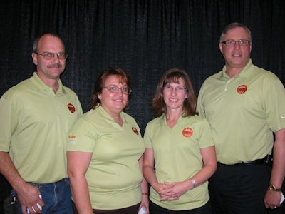 Dealers in Excellence winners Jesse and Sandy Laffely of Brunswick Home & Garden, and Nancy and Scott Jardine of Arn's Equipment.