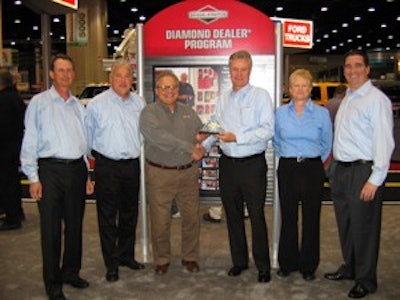 Bill Reitman, senior vice president of sales & service for Briggs & Stratton presented the award to Frank Manno, President of Sedco Inc.