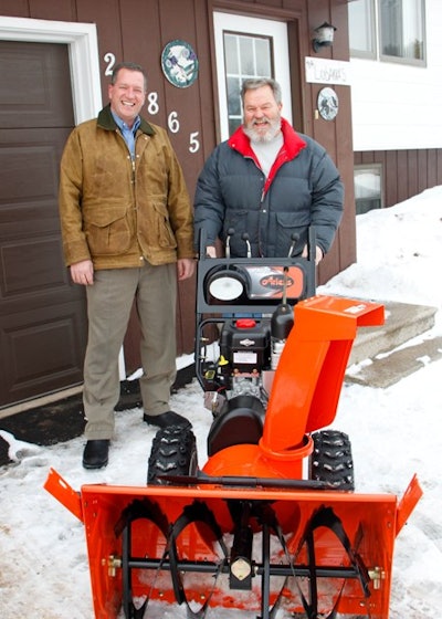 Dan Ariens (left) personally delivers snowthrower