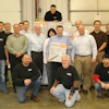 Group of Bryan Equipment Sales employees with the 5 millionth unit sold.