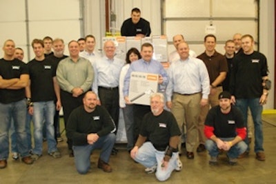 Group of Bryan Equipment Sales employees with the 5 millionth unit sold.
