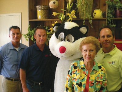 From left: Mark Pugh, Tim Pugh, Pughy the mascot, Arminta Pugh, Michael Pugh