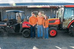 Ken Nelson (center) with his daughter (right) and son (left) in front of TAC’s Moulton, AL, location.