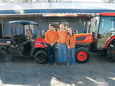 Ken Nelson (center) with his daughter (right) and son (left) in front of TAC’s Moulton, AL, location.
