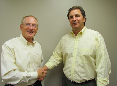 Bill Vogel (L), CEO of Spring Valley and Craig Reinders, president of Reinders Inc., finalize their new partnership.