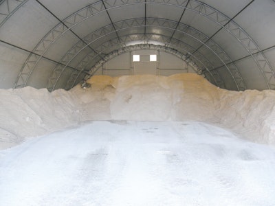 A fabric structure provides a better solution because the salt pile remains completely out of the elements. Due to the height of the structures, equipment can enter and maneuver completely under cover.