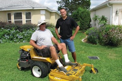 Chad Saucier with mower operator Marc L'Heureux at The Villages in Florida.
