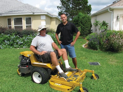 Chad Saucier with mower operator Marc L'Heureux at The Villages in Florida.