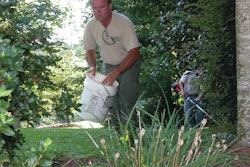 Mike Stegall, company president, is typically pulling or spraying weeds, picking up trash, and looking for problem areas in the lawn.