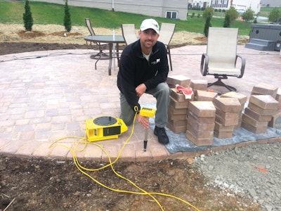 Contractor Chad Beidel with his prized zip level.