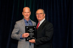 Norman Goldenberg, TruGreen executive and PLANET president (right), presents Greg Harbison of ValleyCrest with one of their five Environmental Improvement awards.