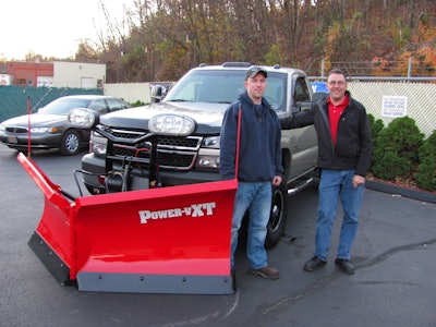 Connor Hedge (left) was awarded a Boss Power-V XT Plow from dealer Kenneth Cashman of Ken's Auto Sales.