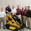Jason Showers (at controls), Boxer product manager, was joined by Morbark's tree care sales team when the first Boxer loader rolled off the Morbark assembly line in March 2013.