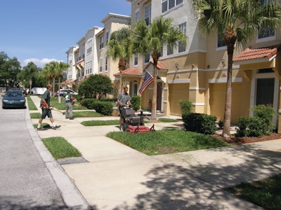 A commercial lawn maintenance crew in Florida. Multi-family housing construction is growing quickly, creating opportunity for landscape contractors.
