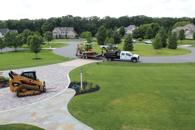 Tim Worrell loves his mini excavator and compact track loader because they can work easily in the mud, and cause little damage to lawns.