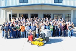 The milestone was celebrated with lunch and a company photo of Walker's 155 employees.