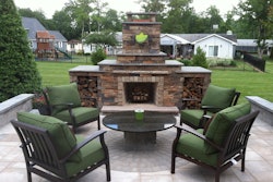 Outdoor living space with fireplace, designed and installed by Jonny Nichols Landscape Maintenance in Dover, DE.