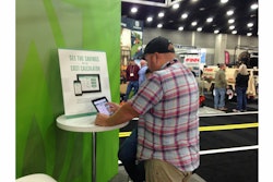 GIE+EXPO attendees try out the PERC cost calculator app in their booth at the show.