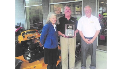 Norfolk Power Equipment Sales Manager Freddy Noonan (center) accepts the New England Dealer of the Year award from Wright Manufacturing Regional Sales & Marketing Manager Judith Ross (left) and EDM Distributors Territory Manager Bill Stantial (right).