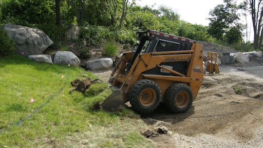 Case skid-steer loader - bucket excavating