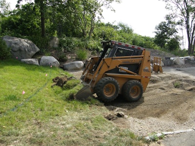 Case skid-steer loader - bucket excavating