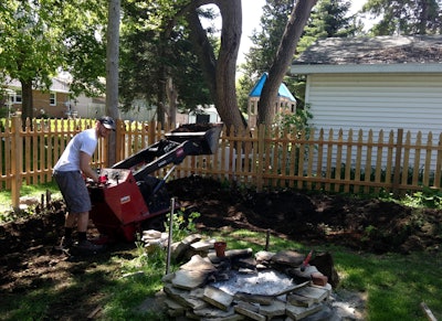 A Toro Dingo mini-loader was used to help build a backyard patio and fire pit.