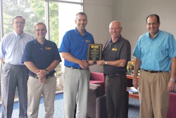 Participating in the Distributor of the Year award presentation are (l to r) Ray Clark, OED vice president of administration; Jim Fenner, OED sales manager; Rob Zucker, OED president; Hal White, Wright vice president of sales; and David Zucker, OED vice president of finance.