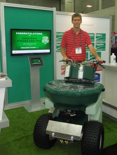 Jason Creel of Alabama Lawn Pros winning his sprayer spreader at GIE+EXPO in the Dow booth.