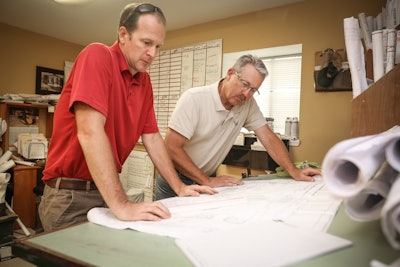 Michael Hatcher (right) with Jeff Peterman, landscape construction manager