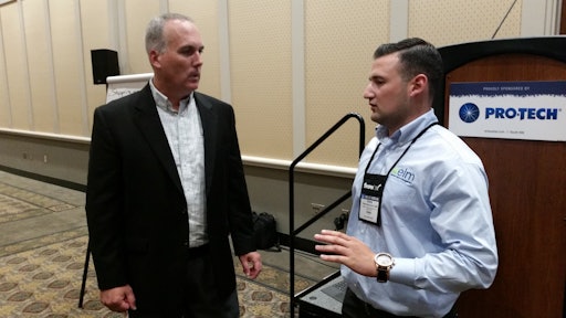 Dan Foley (left) speaks with landscape/snow contractor Alberto Benvenuti, a landscape enhancements project estimator with Eastern Land Management (elm) in Stamford, CT, at the conclusion of Foley's seminar at SIMA 2016.
