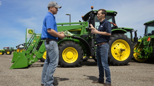 Nate Dorsey (right), RDO Equipment's agronomist based in Moorhead, MN, speaks with a customer.