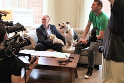 From Left: Kris Kiser; rescue dog Dottie; Lucky the TurfMutt, and Brandon McMillan of Lucky Dog discuss the new episode with the production team.