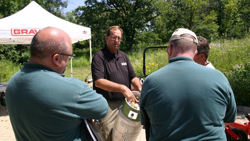 Dealer Mike Halloran talks propane cylinders with interested attendees at the August 2016 Chicago Area Clean Cities Coalition event.
