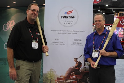Mike Halloran,owner of Halloran Power Equipment, and Ralph Meyer, fleet manager for Sebert Landscaping, receive a personalized Louisville Slugger baseball bat to commemorate the Propane Leadership Awards.