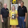 Hal White, Wright vice president of sales, presents the 2016 Distributor of the Year award to Smith Distributing general manager Kandis Caldwell and president Glenn Smith.