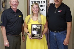 Hal White, Wright vice president of sales, presents the 2016 Distributor of the Year award to Smith Distributing general manager Kandis Caldwell and president Glenn Smith.