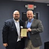 Roger Phelps (right), Stihl Inc. corporate communications manager, accepts a 2016 Channel Partnership Award from Dan Tratensek, NRHA vice president of publishing.