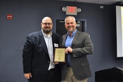 Roger Phelps (right), Stihl Inc. corporate communications manager, accepts a 2016 Channel Partnership Award from Dan Tratensek, NRHA vice president of publishing.