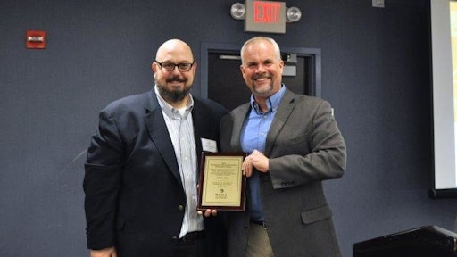 Roger Phelps (right), Stihl Inc. corporate communications manager, accepts a 2016 Channel Partnership Award from Dan Tratensek, NRHA vice president of publishing.