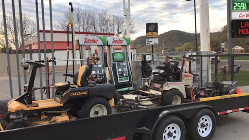 Reliable Lawn Care's t railer makes room for a Grasshopper diesel mower, a Cub Cadet zero turn mower and a Toro 30-inch walk behind.