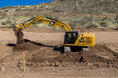 Caterpillar 320 digging a foundation.