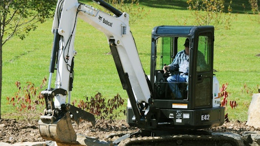 A Bobcat E42 compact excavator makes for easy work of a retaining wall.