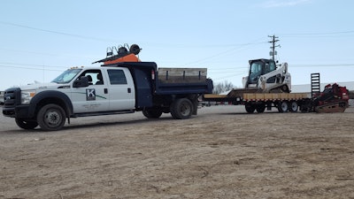 Construction crews take advantage of extra room provided by cab overhang and deck-over trailers.