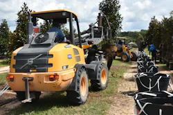 The loaders can be fitted with a customized tree boom attachment to transplant and move trees.